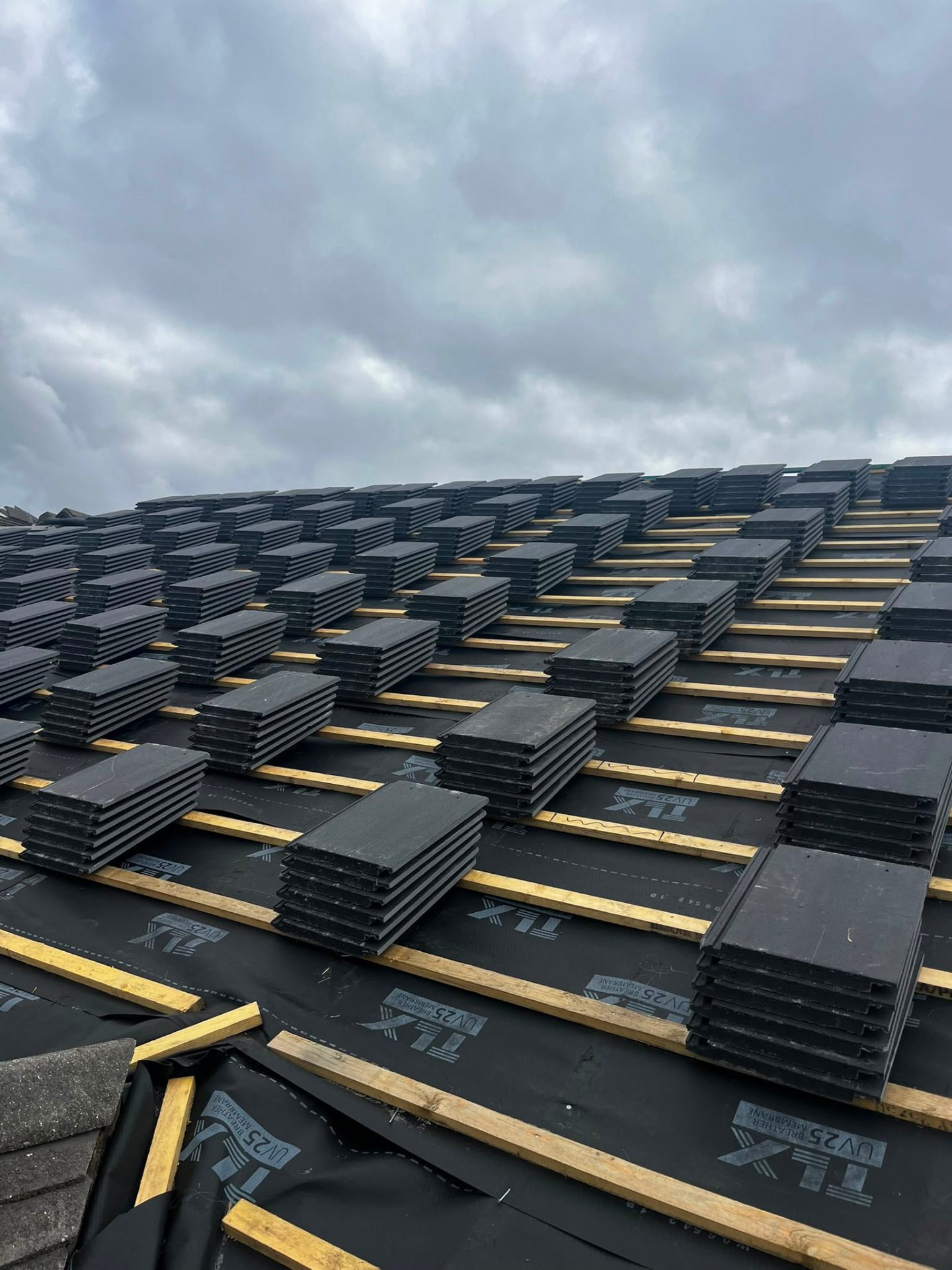 Finished dark-grey GRP fibreglass flat roof with clean upstand fillets, installed by RTC Roofing
