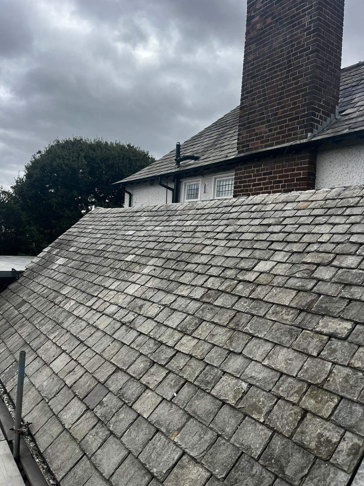 Weathered original grey natural slate roof photographed pre-works during an RTC Roofing survey, Merseyside