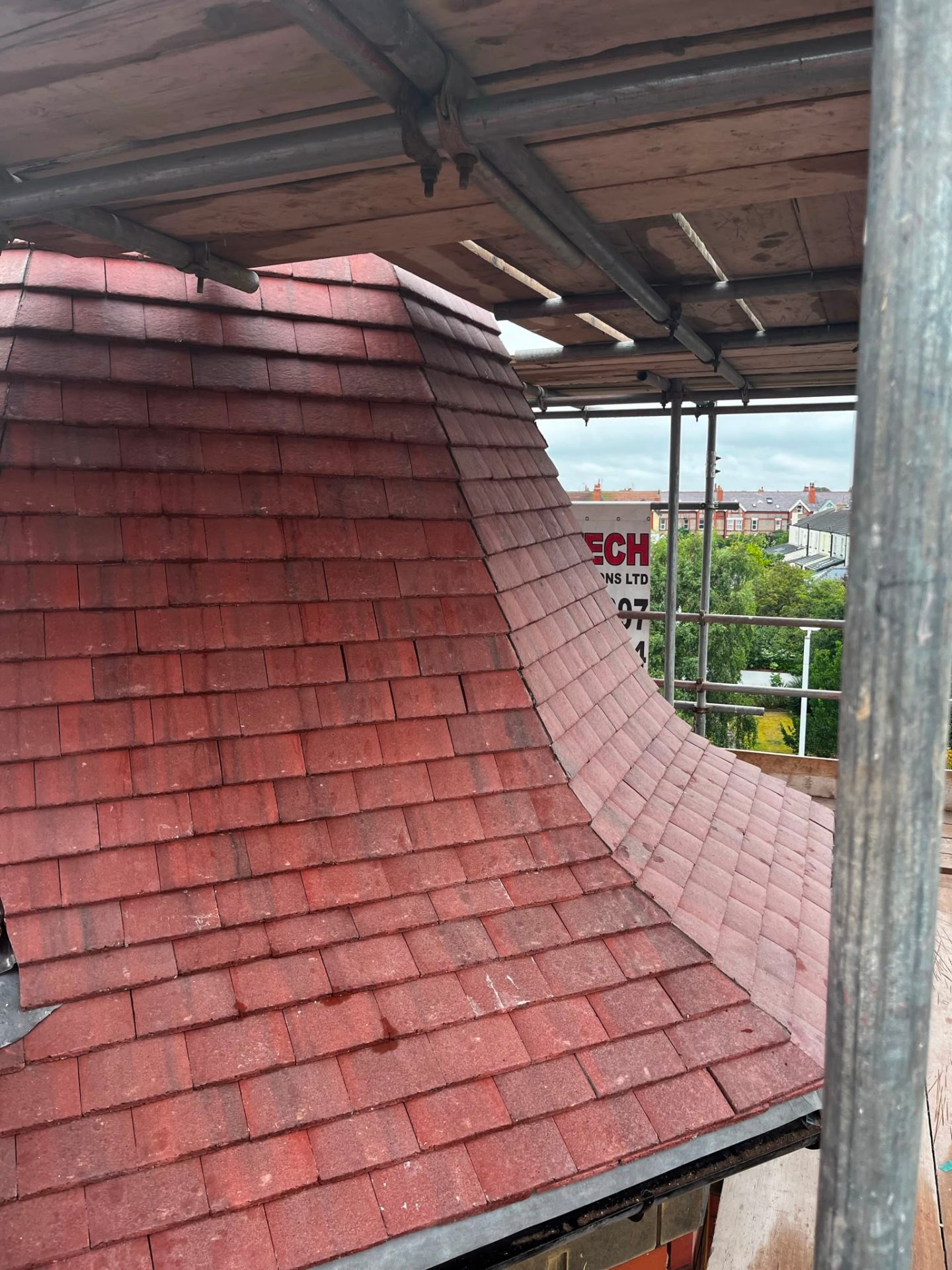Curved eyebrow tile detail in red clay plain tile roofing, executed by RTC Roofing on a heritage Wirral property