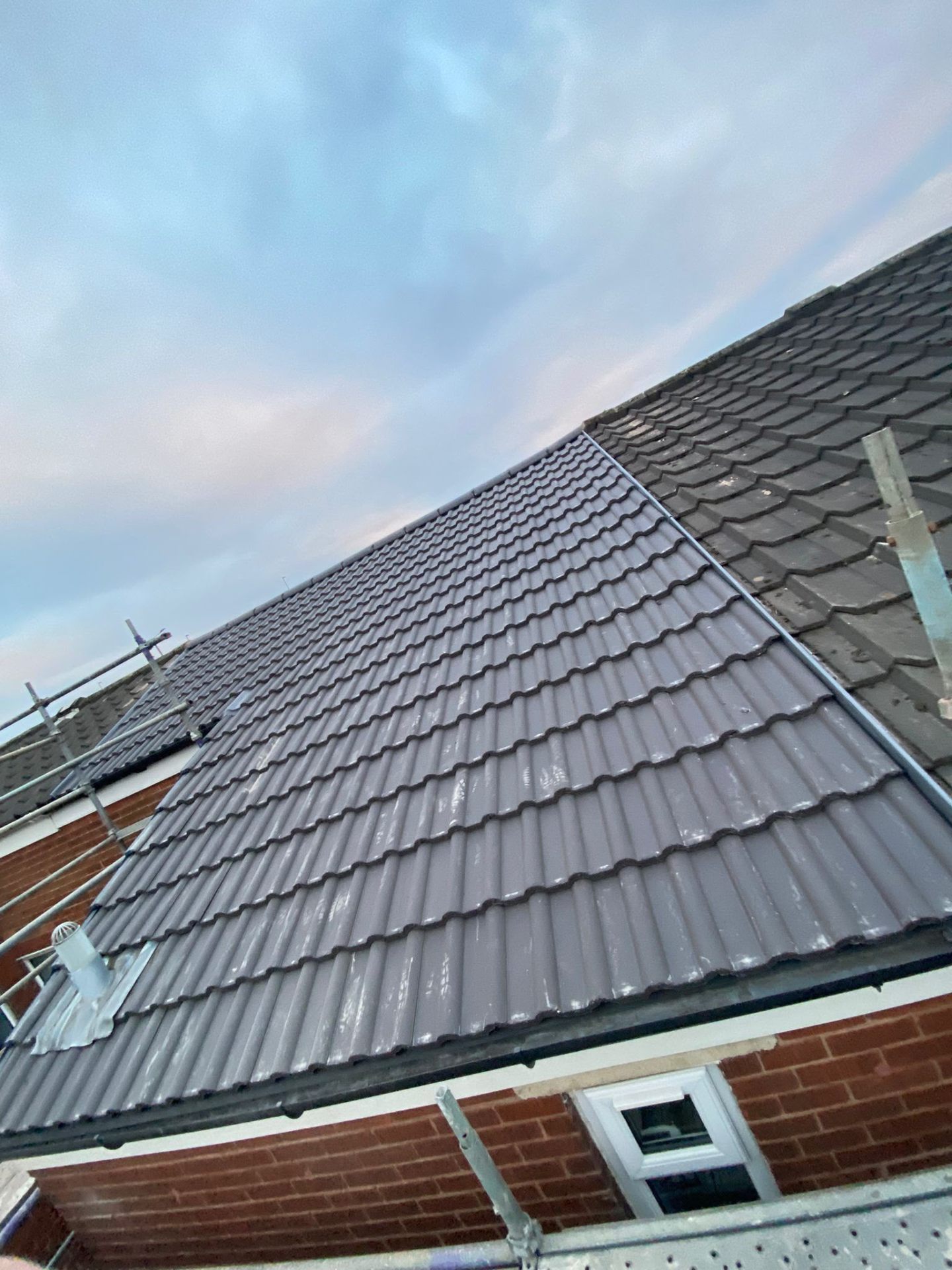 Fresh natural slates stacked on treated battens over breathable UV25 membrane, ready to fix — RTC Roofing